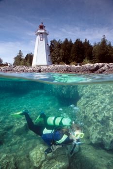 "The Lighthouse" - Tobermory, Ontario, Canada.  A very po... by Ian Brooks 